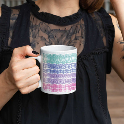 Woman in black holding bright stripes hidden message embroidery mug, 11oz