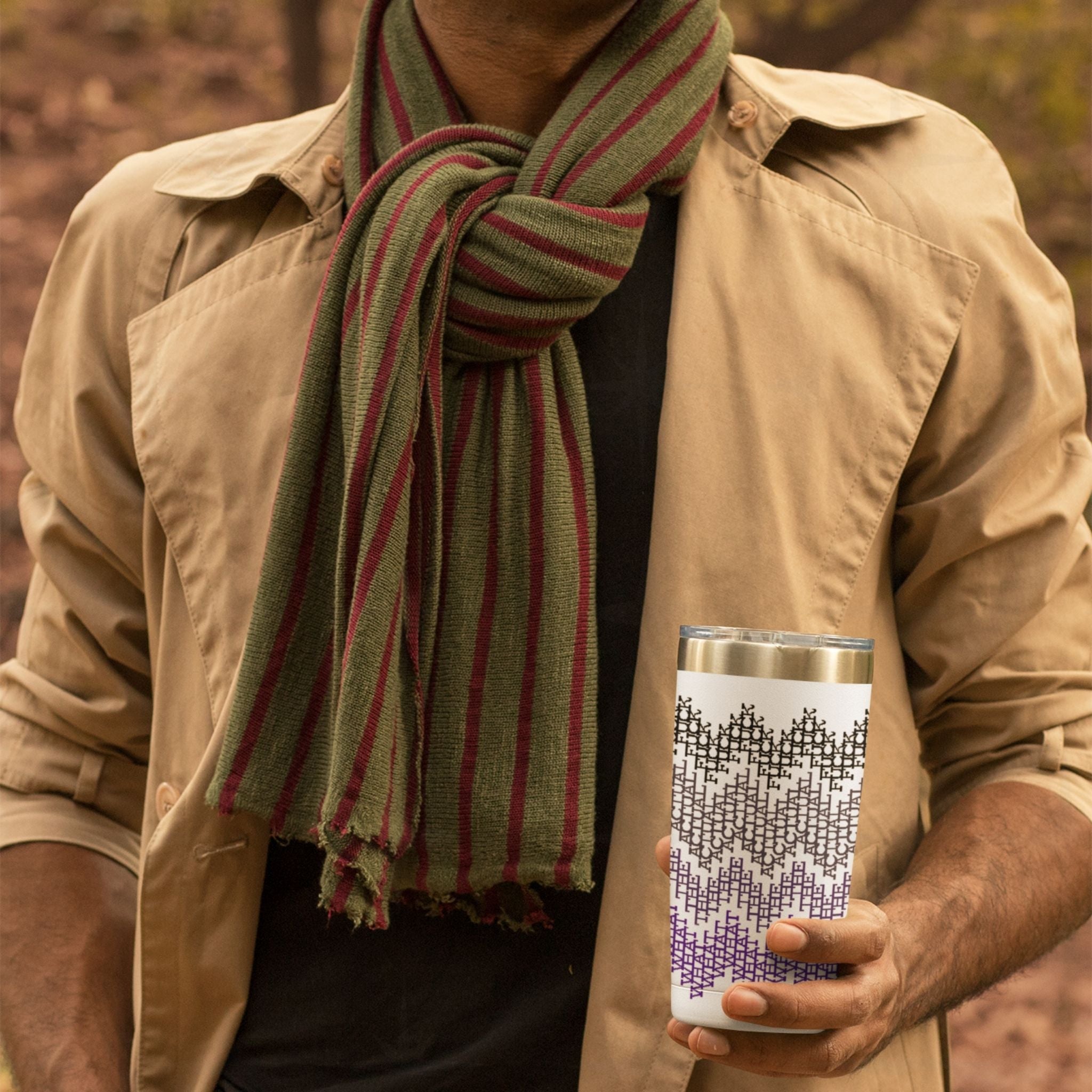 Man in tan jacket holding purple ombre hidden message tumbler outdoors, fair isle swear word pattern visible on stainless steel

