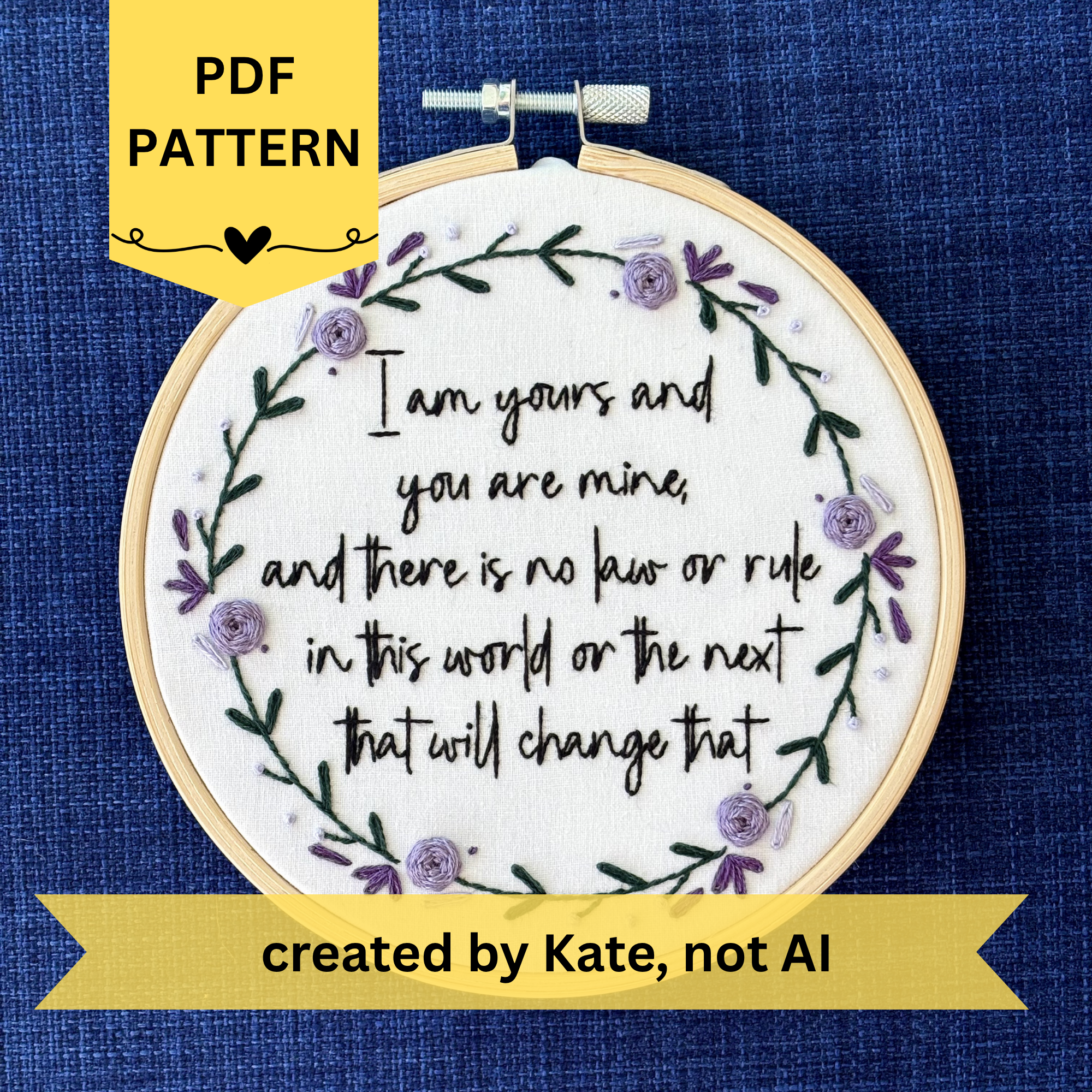 PDF pattern created by Kate, not AI. "I am yours and you are mine, and there is no law or rule in this world or the next that will change that." Quote hand embroidered in strong handwriting font in black embroidery floss. Surrounding the text is a wreath of dark green stems and leaves with lavender, violet, and deep purple flower petals, roses, and rose buds. Sewn on white cotton. Framed as wall art in a light wood embroidery hoop.