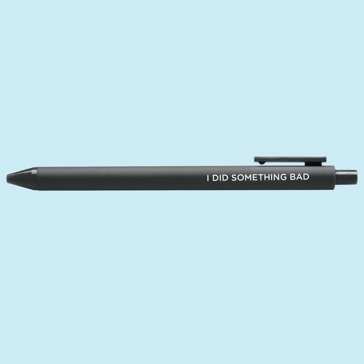 I Did Something Bad jotter gel pen detail — close up of the embossed lettering on the black barrel by MangoIllustrated