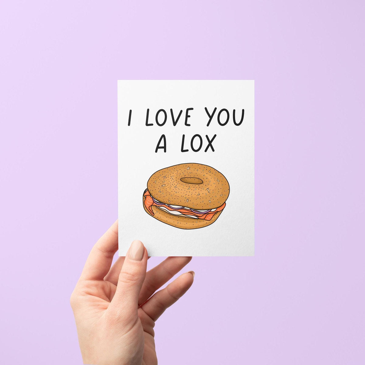 I love you a lox card flat lay — illustrated food pun Valentine&