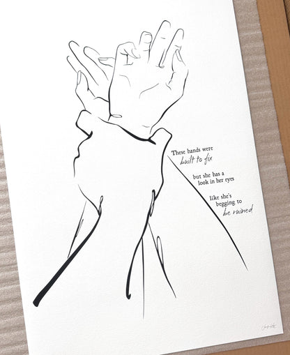 Black and white line art illustration "I Got You," of two hands clasped together. The text reads "These hands were built to fix but she has a look in her eyes like she&