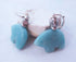 Handcrafted Amazonite Bear Earrings feature turquoise bear-shaped stones and silver bead accents, inspired by Sterling Silver Zuni Jewelry, and are displayed against a light background.