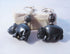 Hippo earrings featuring carved hematite hippos, a stunning piece of hippopotamus jewelry.