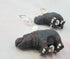 Hand-Painted Hippo Earrings: Lever Back Animal Jewelry—unique earrings with small black hippo figurines accented by white and red details, finished with silver beads and lever back hooks, displayed on a light surface.