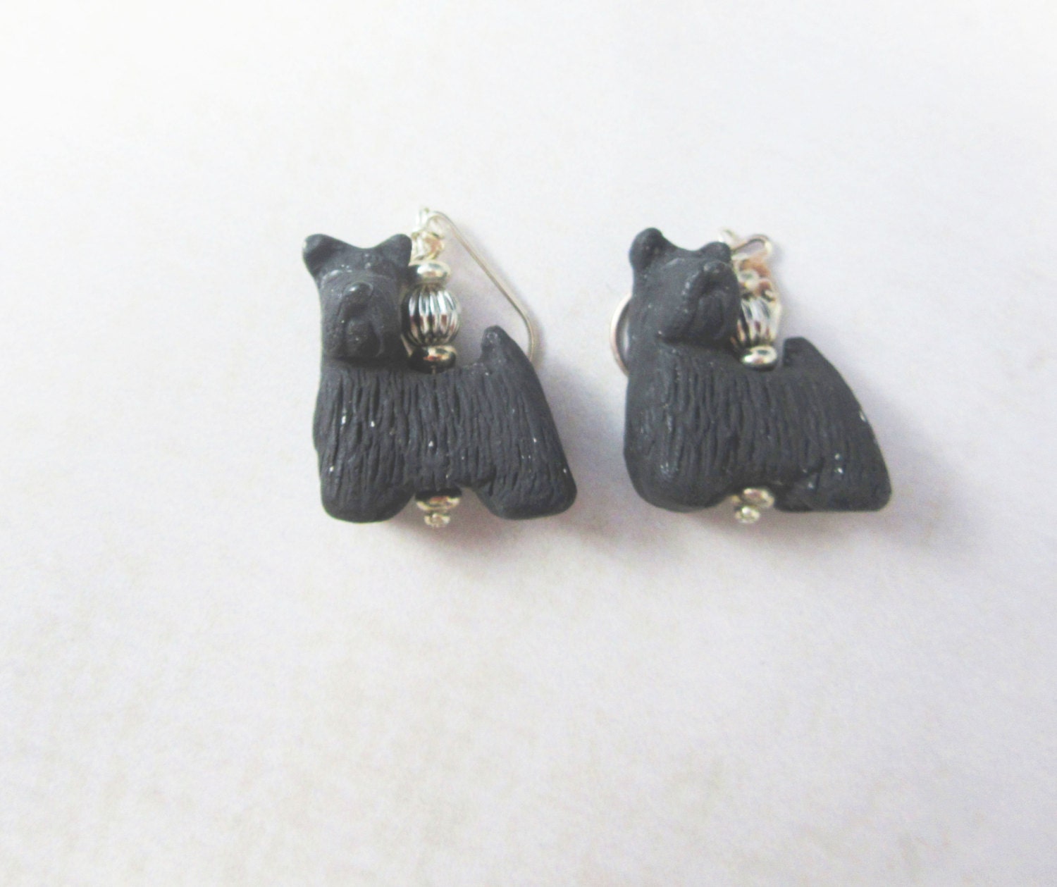White Scotty Dog Earrings, ideal for dog lovers, showcasing a high polished finish and whimsical design.