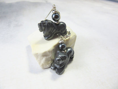 Close-up of Carved Hematite Lion Earrings, highlighting their unique animal-themed design, a perfect gift for a mammologist or anyone who loves wildlife.