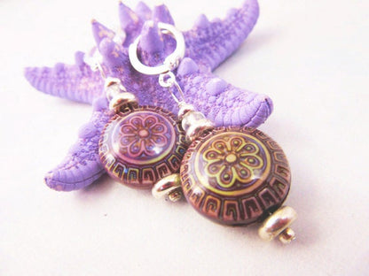 Magic Mood Change mandala earrings showcasing a colorful floral design that changes color according to body temperature.
