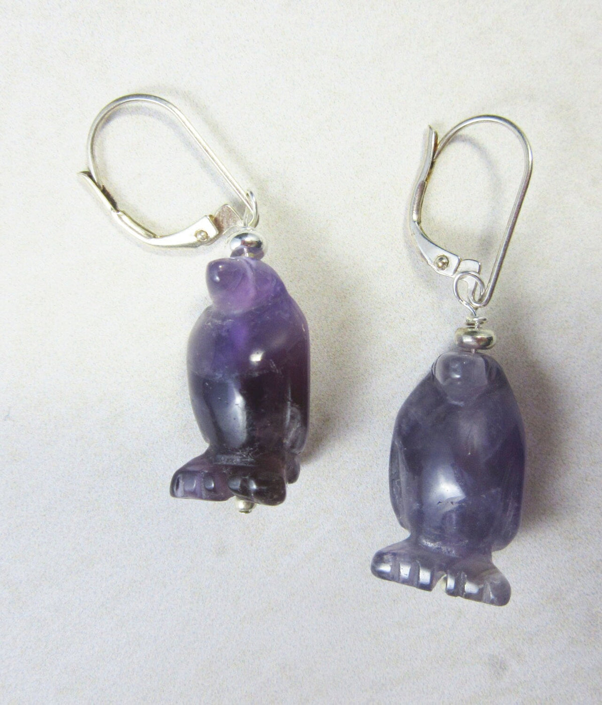 Penguin necklace made from purple amethyst, a perfect funny gift for her, showcasing a carved stone animal jewelry design.