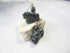 The Lion Hematite Earrings – Animal Themed Grounding Stone Jewelry feature carved black stone lion figures with round beads, showcased on a white, irregular stone surface against a light gray background.