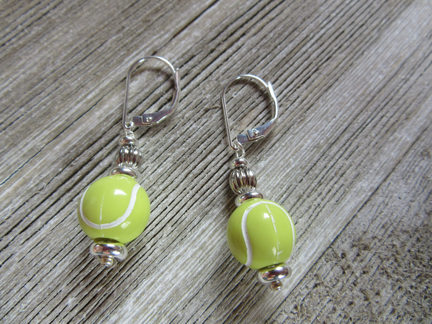 Tennis Earrings featuring a tennis ball design, perfect gift for tennis players and fans, part of Enlivenadorn by Gwynstone&