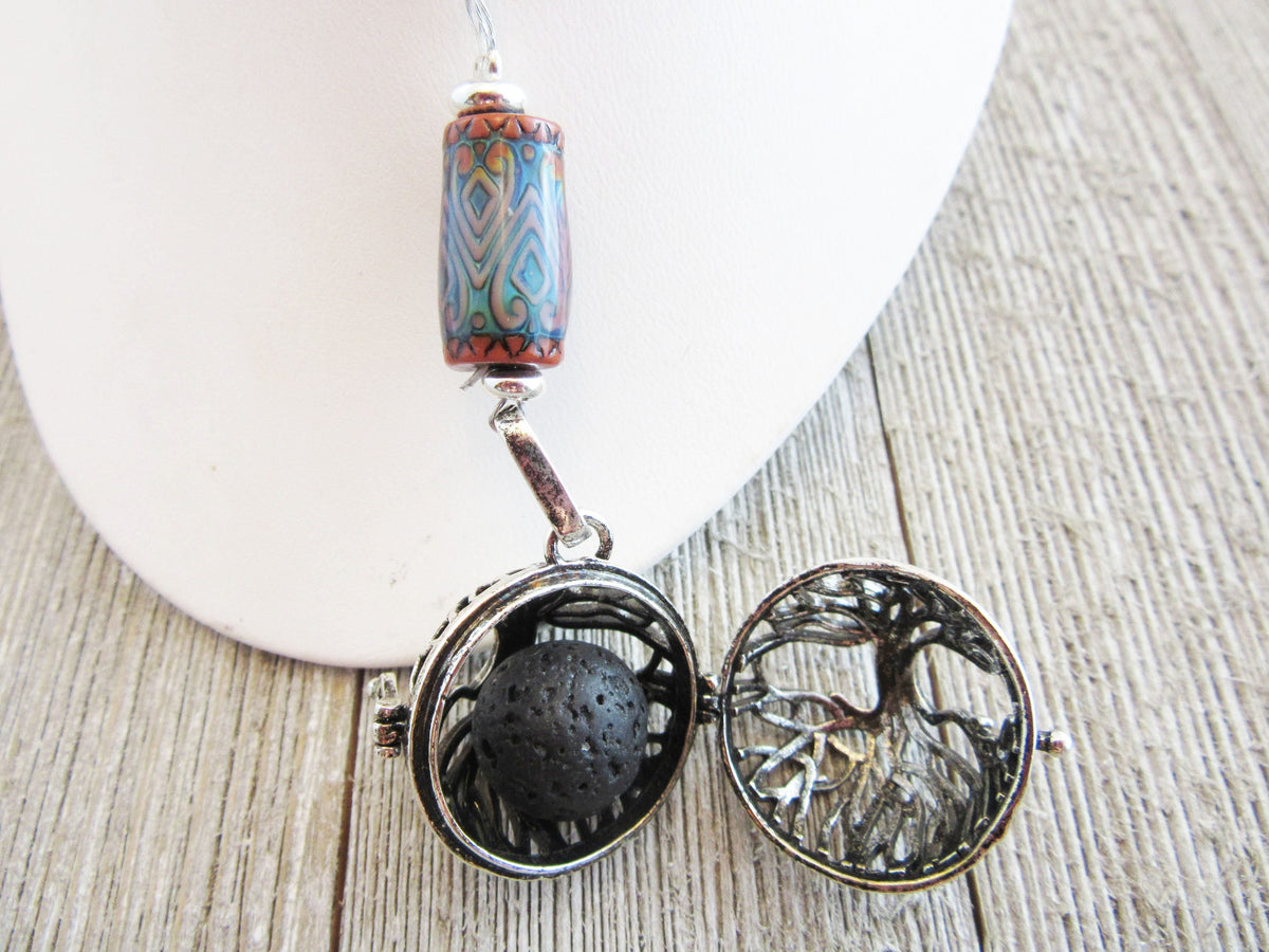 COLOR CHANGING essential oil jewelry featuring a beautiful tree of life design, this aromatherapy essential oils diffuser necklace adds a colorful touch and promotes relaxation.