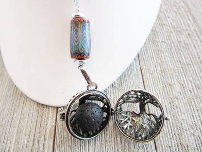 COLOR CHANGING essential oil jewelry featuring a beautiful tree of life design, this aromatherapy essential oils diffuser necklace adds a colorful touch and promotes relaxation.