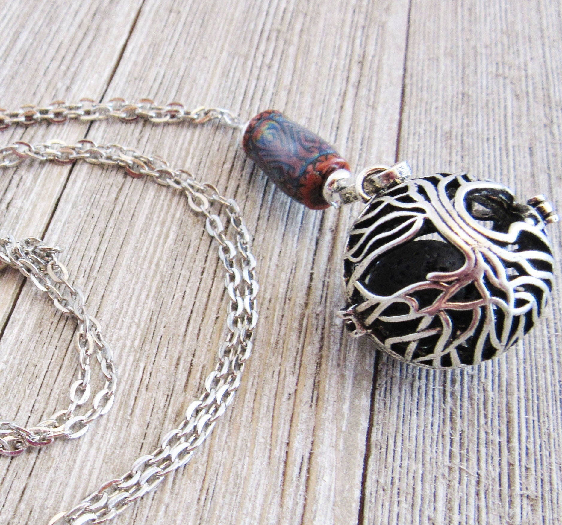 COLOR CHANGING essential oil jewelry, a beautiful aromatherapy essential oils diffuser necklace with Tree of Life design, ideal for enhancing relaxation and mood.