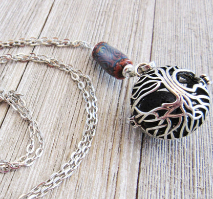 COLOR CHANGING essential oil jewelry, a beautiful aromatherapy essential oils diffuser necklace with Tree of Life design, ideal for enhancing relaxation and mood.