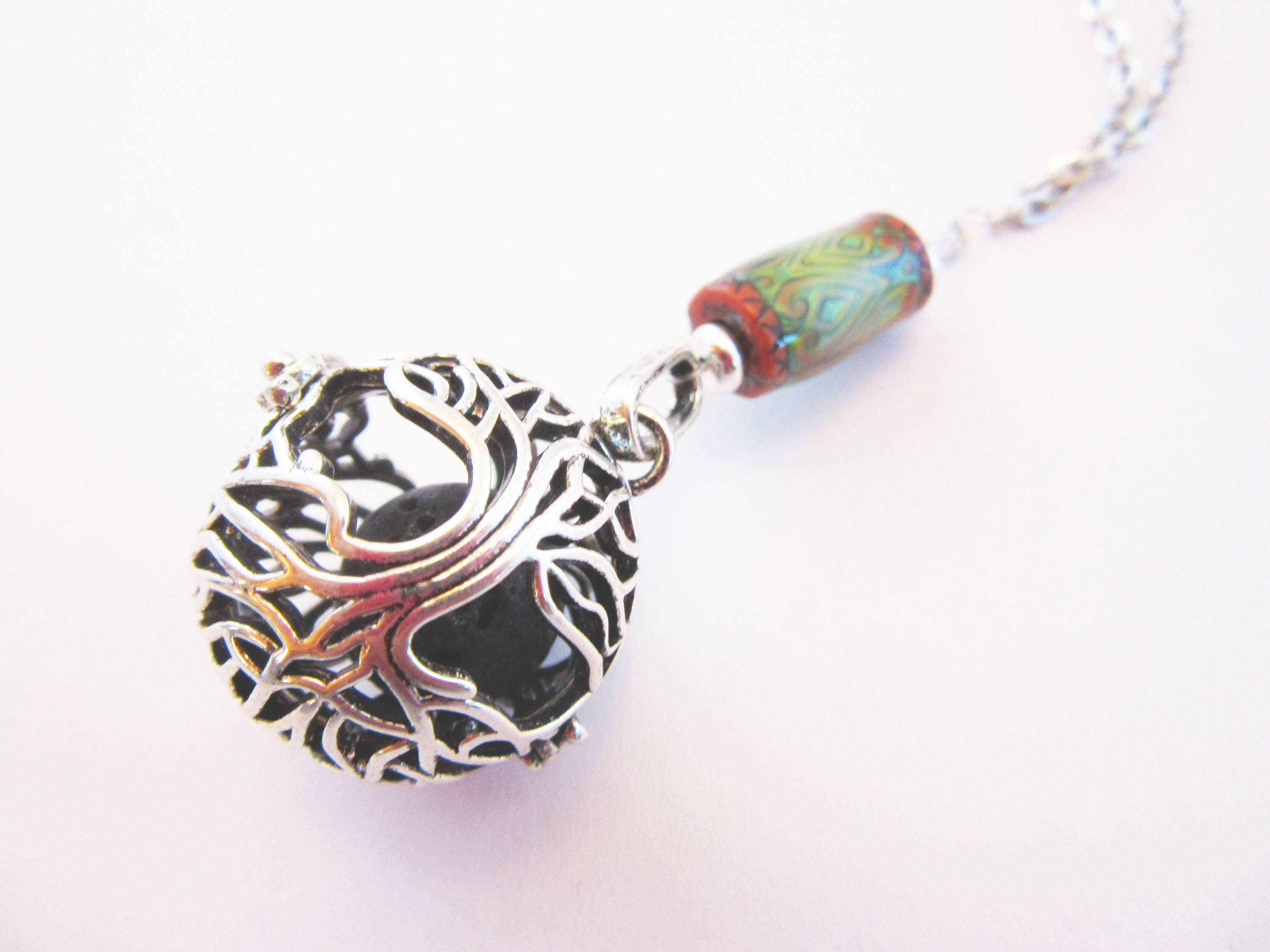 Elegant display of COLOR CHANGING essential oil jewelry, featuring a versatile aromatherapy essential oils diffuser necklace perfect for yoga and meditation practices.