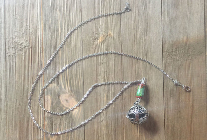 Close-up of COLOR CHANGING essential oil jewelry, showcasing intricate detail of the aromatherapy diffuser necklace, which transforms colors based on body temperature.