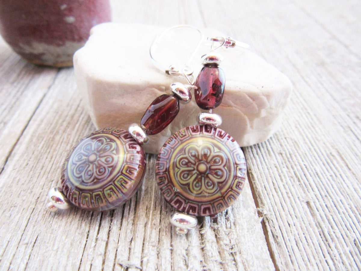 Beautiful Magic Mandala and Garnet necklace displayed on a chain, emphasizing the color-change feature, perfect as a gift for spiritual and zen enthusiasts.