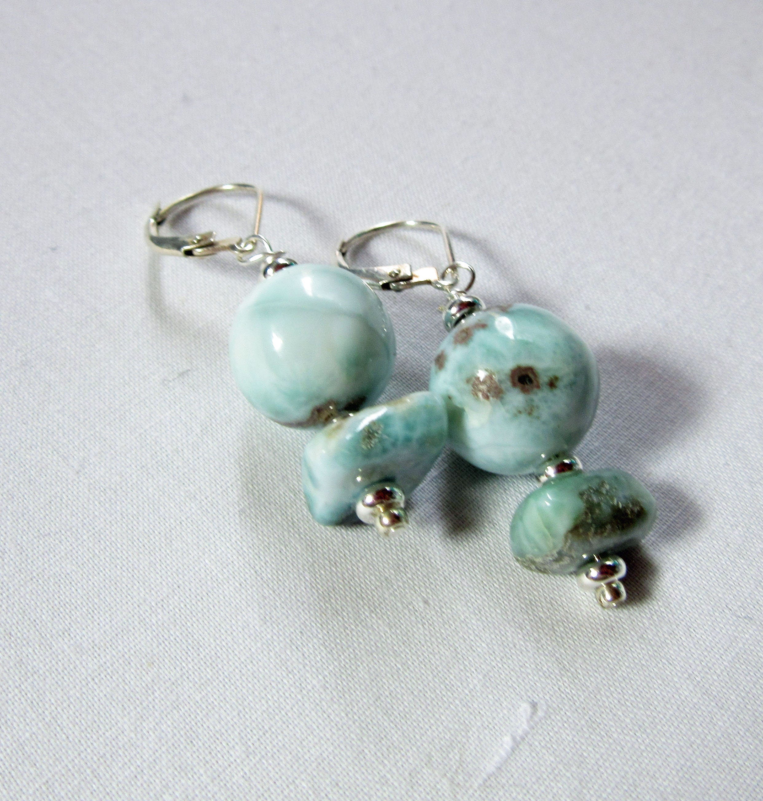 Close-up of Larimar Earrings showcasing stunning sky blue colors, handcrafted Dominican jewelry for the beach lover, ideal gift.