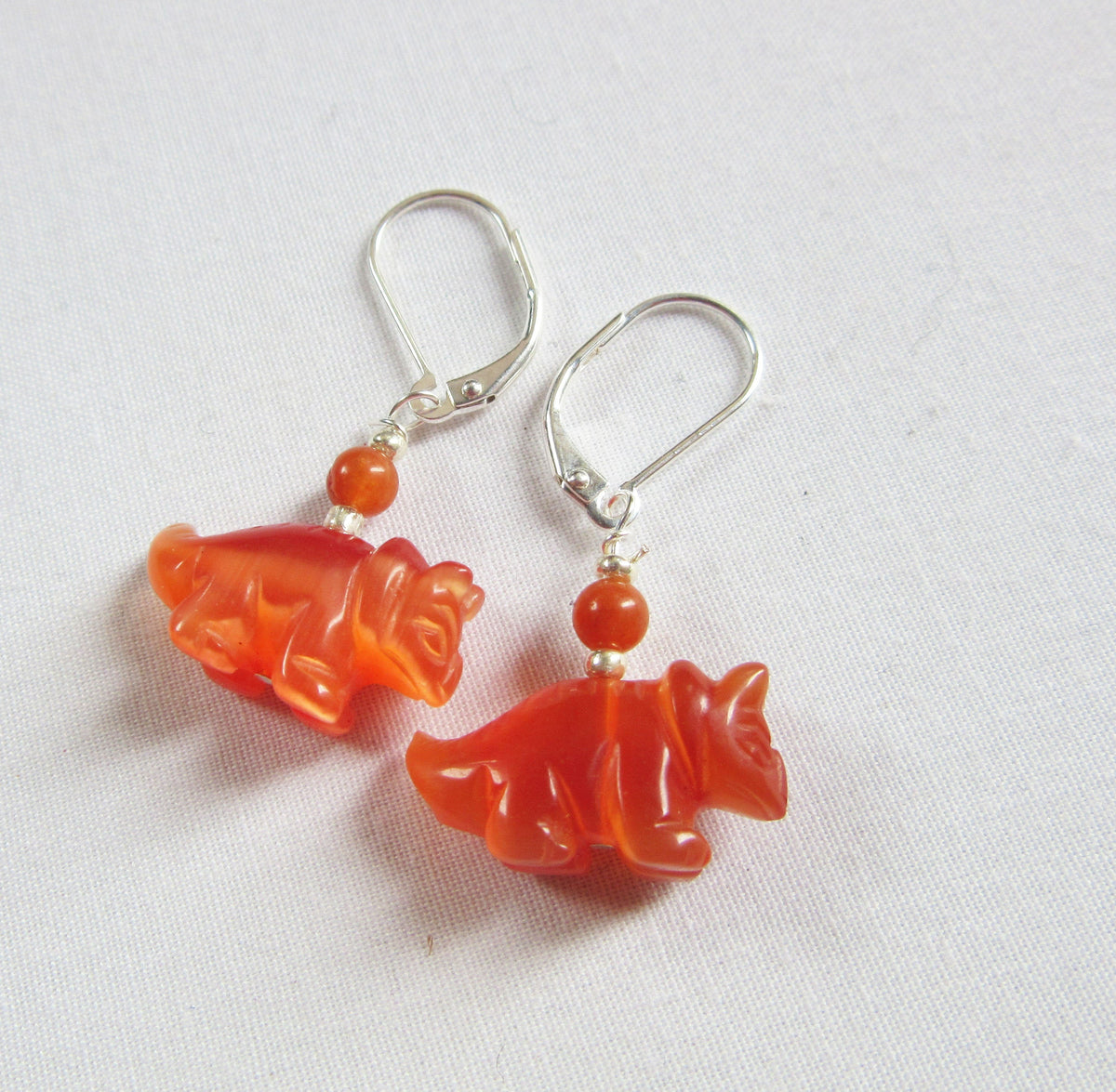Triceratops earrings, blue dinosaur earrings, fun and quirky dinosaur jewelry perfect as a silly gift.
