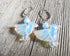 Hummingbird lover earrings made from sodalite and opalite, featuring carved bird designs, a perfect gift for bird lovers and moms, symbolizing hope and jubilation, handcrafted by Enlivenadorn by Gwynstone.