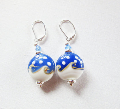 Ocean Wave Earrings say Hello - elegant gold earrings perfect for beach lovers, on sterling silver lever back, showcasing a unique ocean wave design.