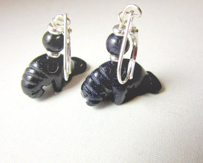 Artisan-made Manatee Earrings displayed elegantly, highlighting the unique carved animal design perfect for sea life enthusiasts.