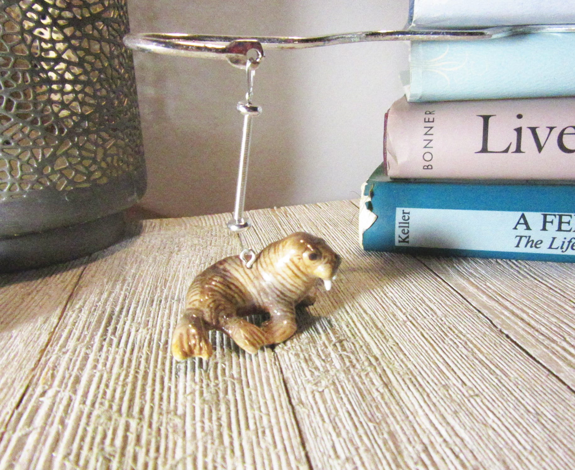 Walrus Lover Bookmark - Porcelain walrus figurine with an 8-inch squiggly metal bookmark, ideal for avid readers and as a fun gift.