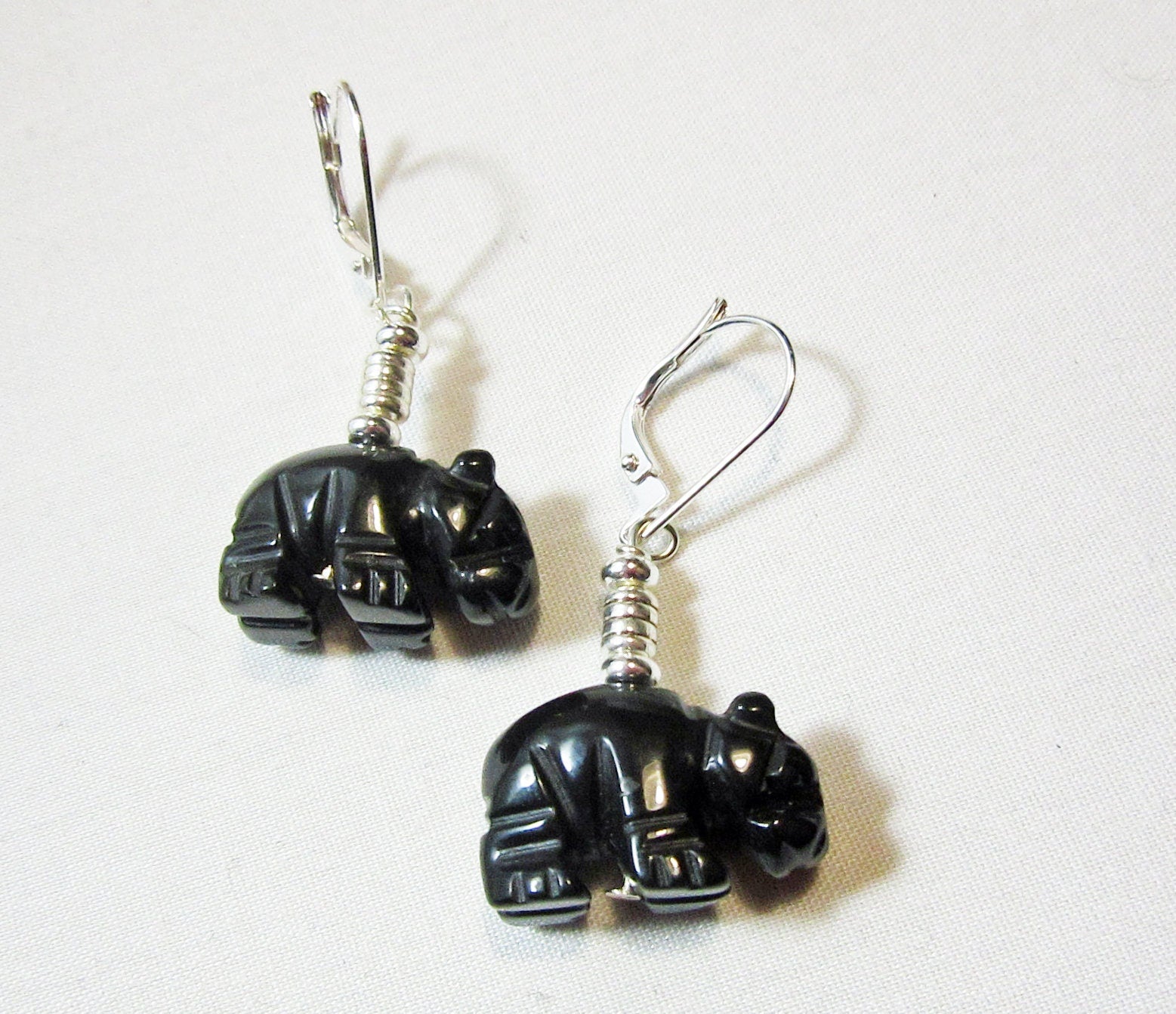 Hippo gift featuring hippo earrings made of carved black onyx stone, perfect for hippopotamus jewelry lovers.