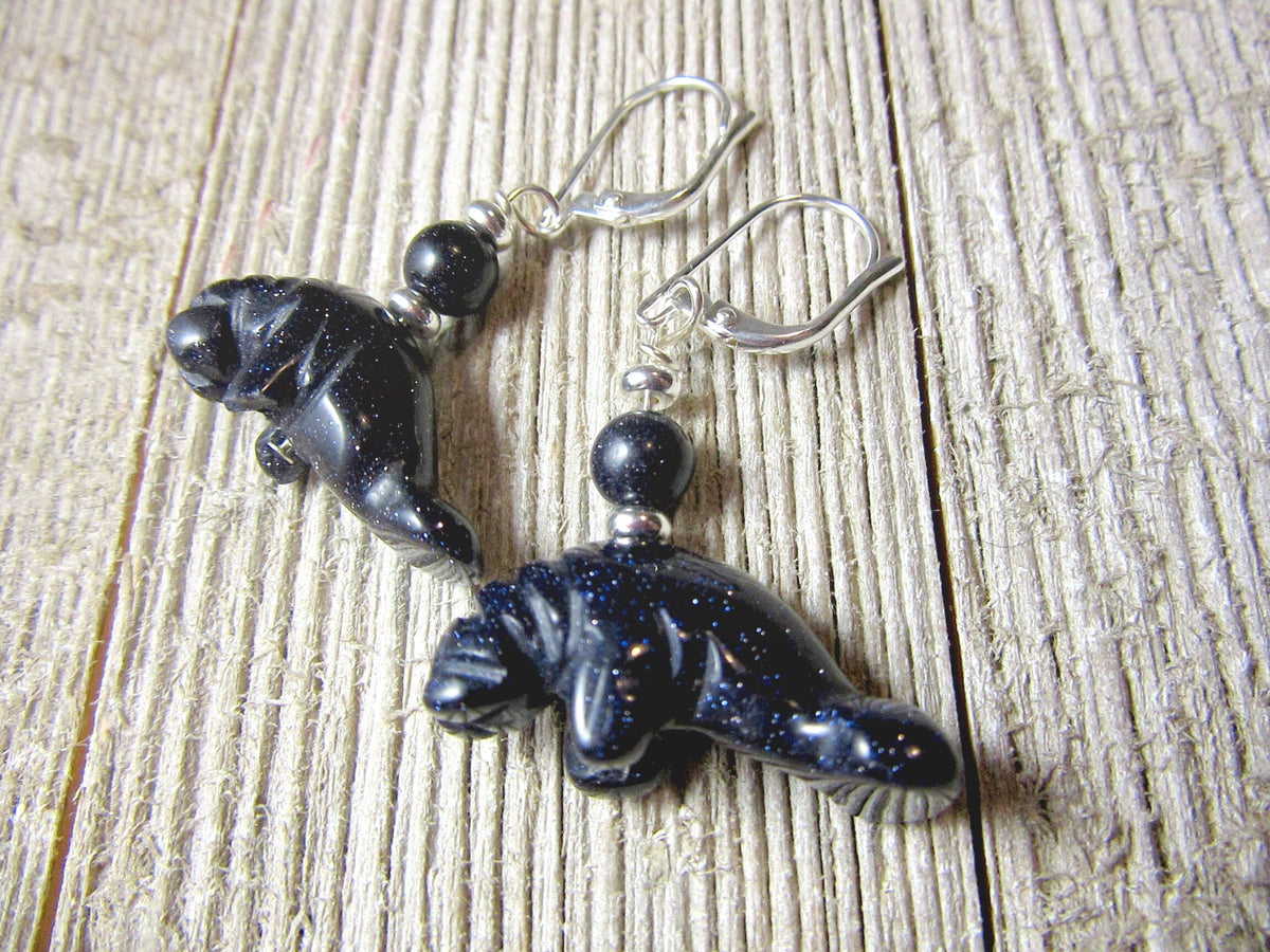 Manatee Earrings - artisan-made jewelry featuring sparkling carved animals in blue and orange goldstone, a unique gift for beach sea life lovers.