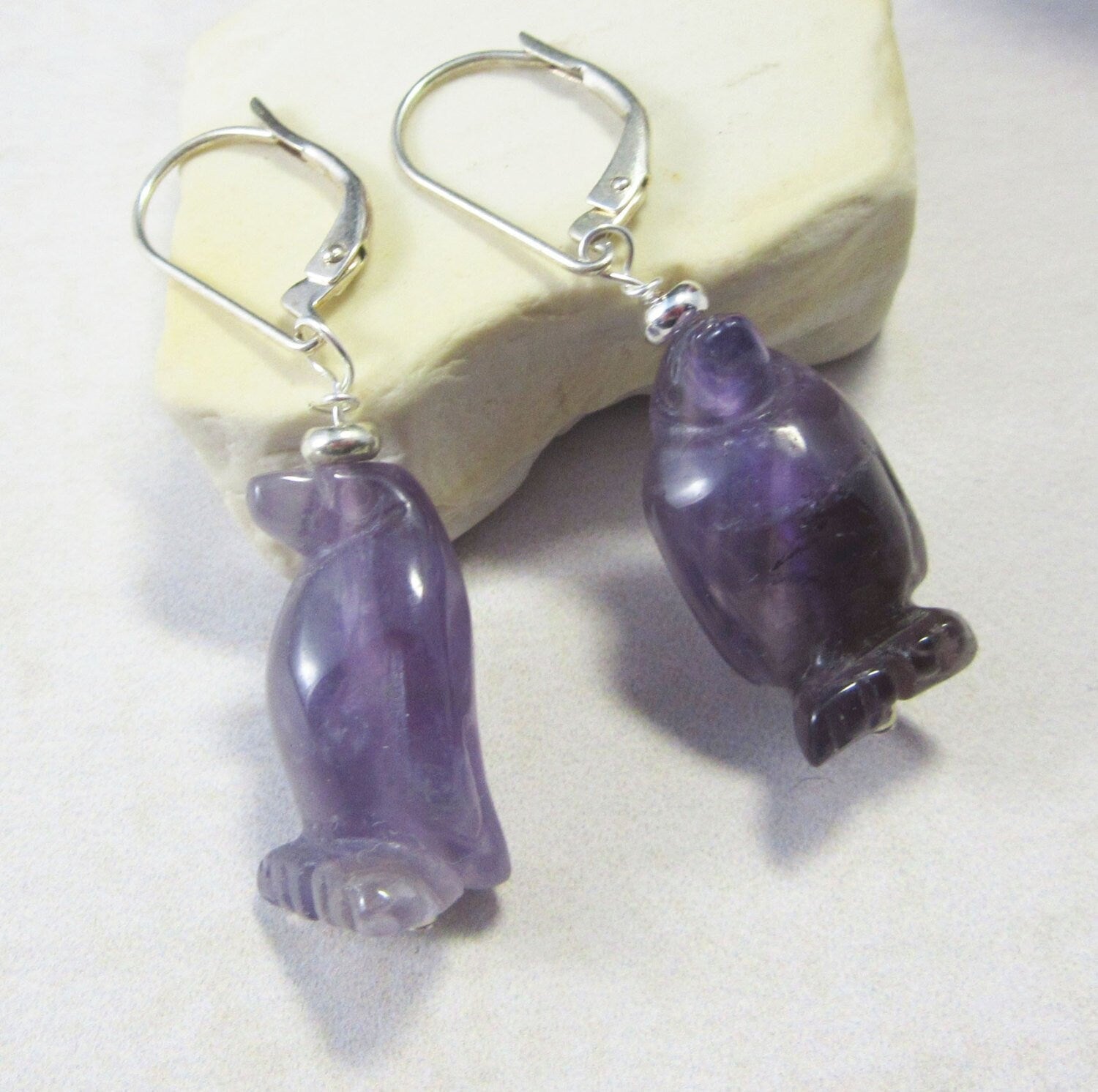 Penguin necklace crafted from amethyst, showcasing a charming purple penguin design, ideal for any penguin lover.