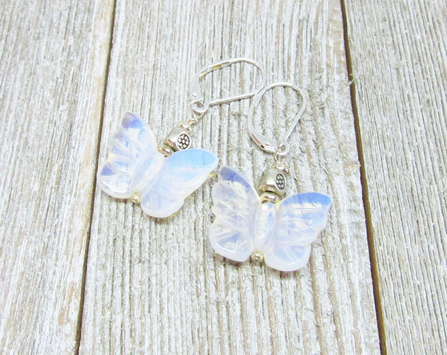 Pink Rose Quartz butterfly earrings - artisan crafted jewelry representing love and gentleness, ideal gift for any occasion.