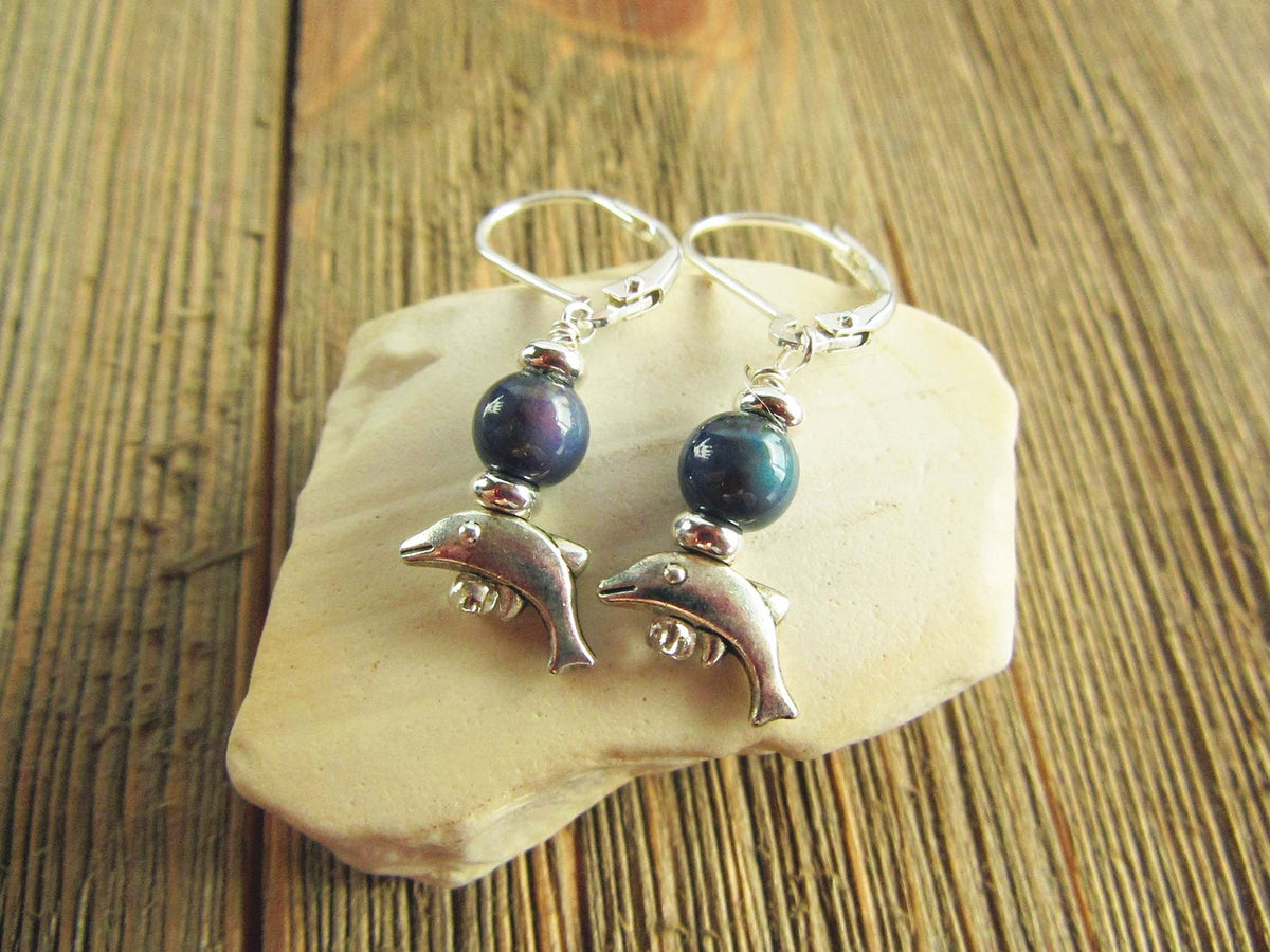 Small Silver Animal theme Earrings displayed on a stylish background, highlighting the dolphin and mood bead topper - Ideal ocean lover gift.