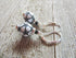 Soccer Ball Lever Back Earrings | Sports Jewelry Gift feature black and white soccer ball beads with silver and black accents, adding a playful sports touch. Perfect for any fan, these earrings are displayed on a wooden surface.