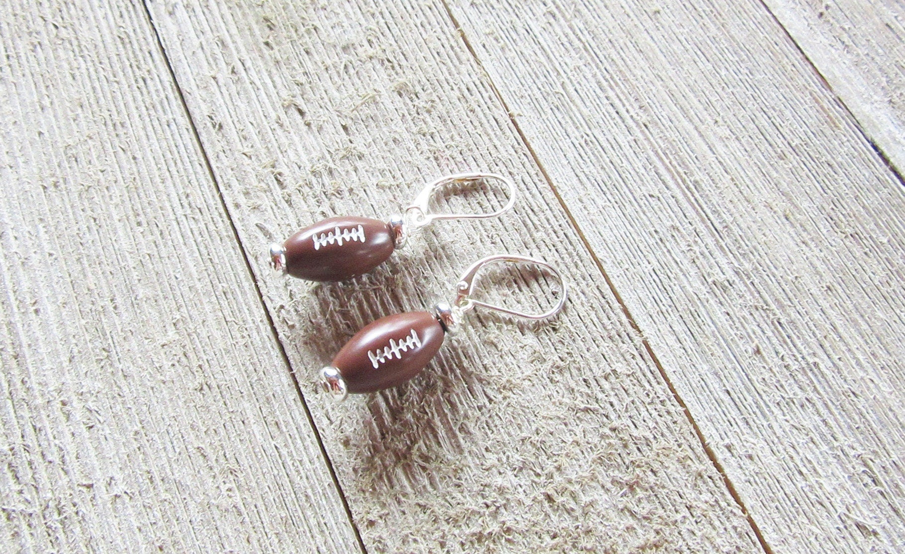 Football Novelty Earrings displayed elegantly, ideal for game day jewelry, capturing the spirit of cheering for your sports team.