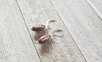 Football Novelty Earrings displayed elegantly, ideal for game day jewelry, capturing the spirit of cheering for your sports team.