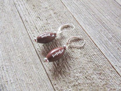 Football Novelty Earrings by Enlivenadorn - Handmade sterling silver earrings for sports enthusiasts.