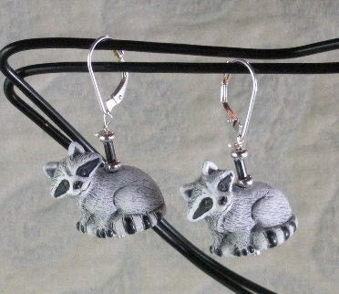 Close-up of RACCOON EARRINGS with hematite stone, highlighting the adorable raccoon design, perfect for nature enthusiasts and bohemian jewelry fans.