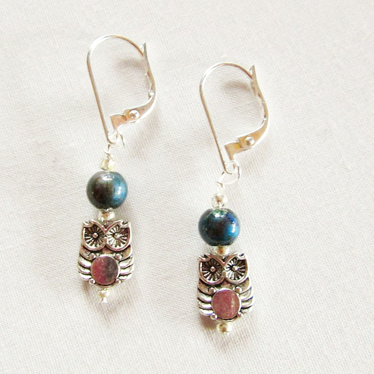 Close-up view of color changing mood bead jewelry in Woodland Owl Earrings, ideal for nature lovers.