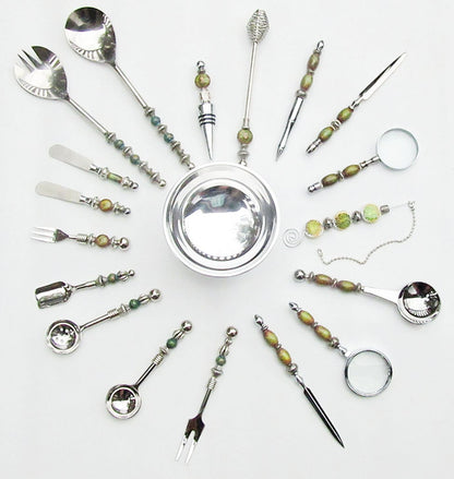 Versatile party serving set with olive fork and matching stainless steel utensils, ideal for any gathering.