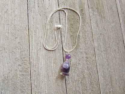Handmade penguin necklace crafted from amethyst gemstones, a unique gift for her featuring a cute carved stone animal.