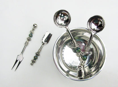 Party serving set featuring custom design stainless steel fork and slotted spoon, perfect for hosting.