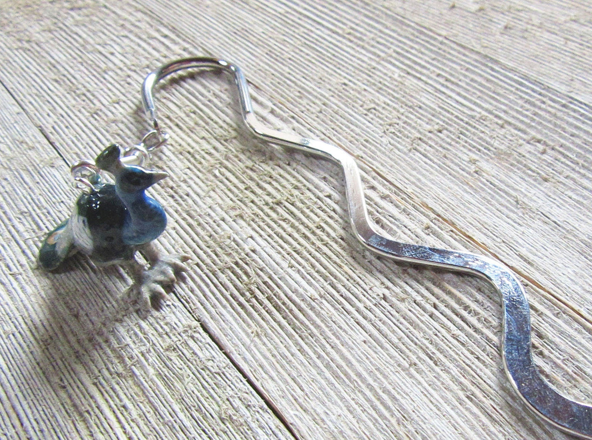 Elegant Peacock Bookmark in use, enhancing a reading experience for book enthusiasts.