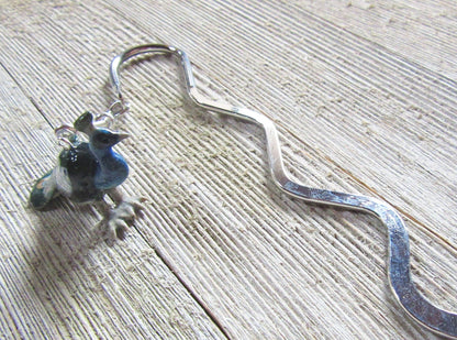 Elegant Peacock Bookmark in use, enhancing a reading experience for book enthusiasts.