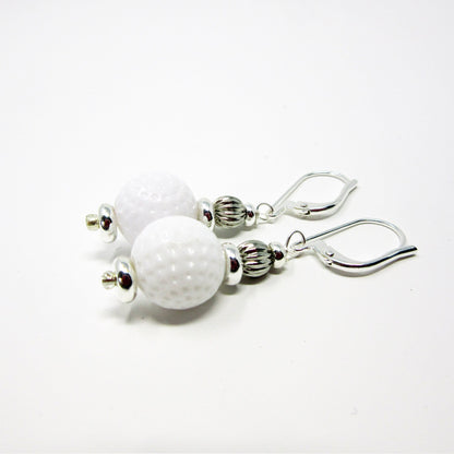Golf Earrings a Gift for Woman Golfer set against a rustic backdrop, emphasizing the unique handmade quality.