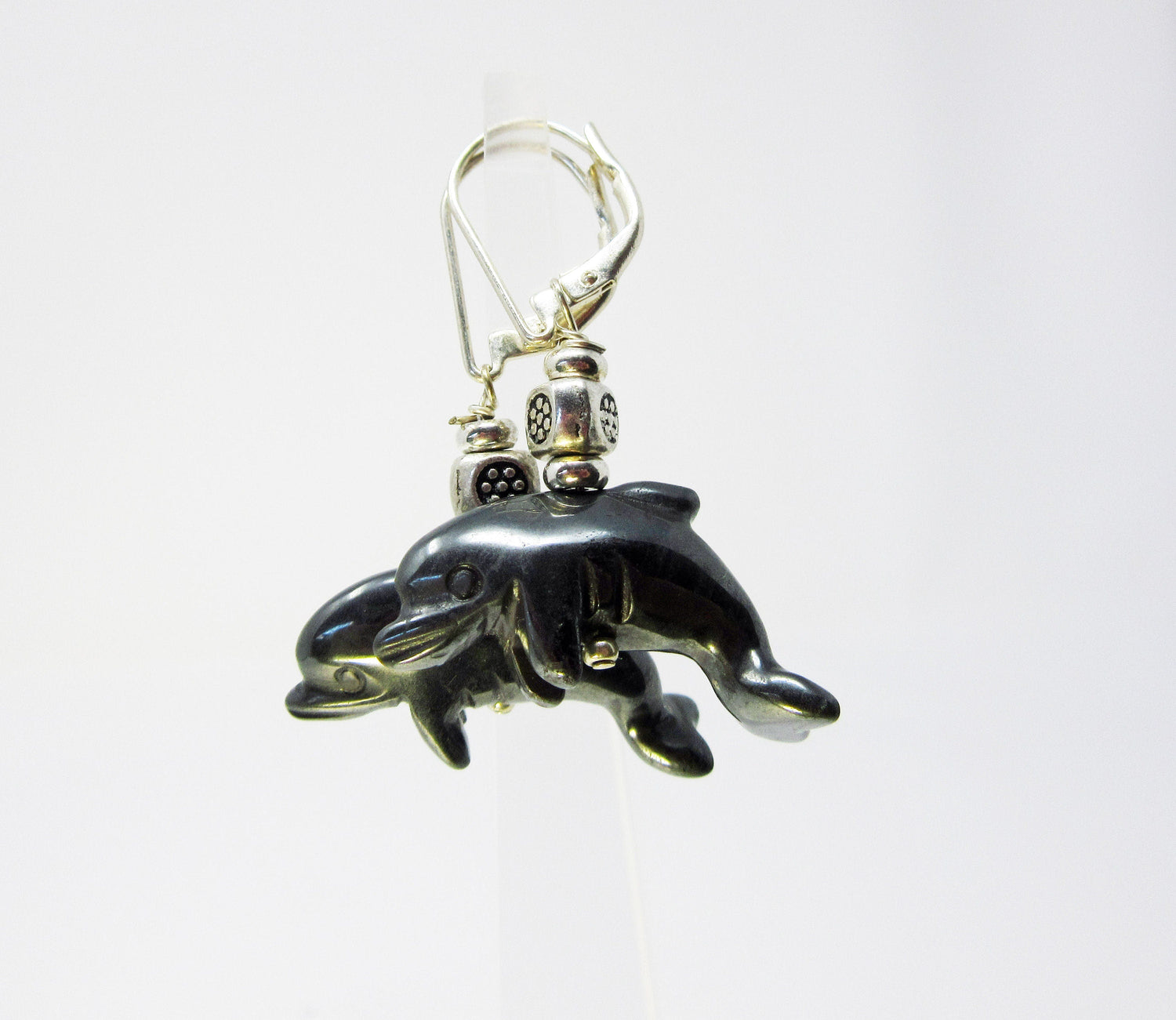 Dolphin Earrings Carved Black Hematite - Beautifully crafted dolphin earrings showcasing the unique shades of black hematite.
