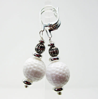 Close-up of Golf Earrings a Gift for Woman Golfer, highlighting the light design for comfortable wear.