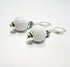 Golf Ball Lever Back Earrings: Novelty Jewelry Gift featuring white golf ball-textured beads with silver accents and secure hooks—an ideal accessory for golf jewelry enthusiasts.