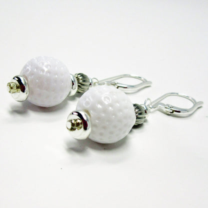 Golf Earrings a Gift for Woman Golfer worn by a person, perfect for any golf enthusiast.