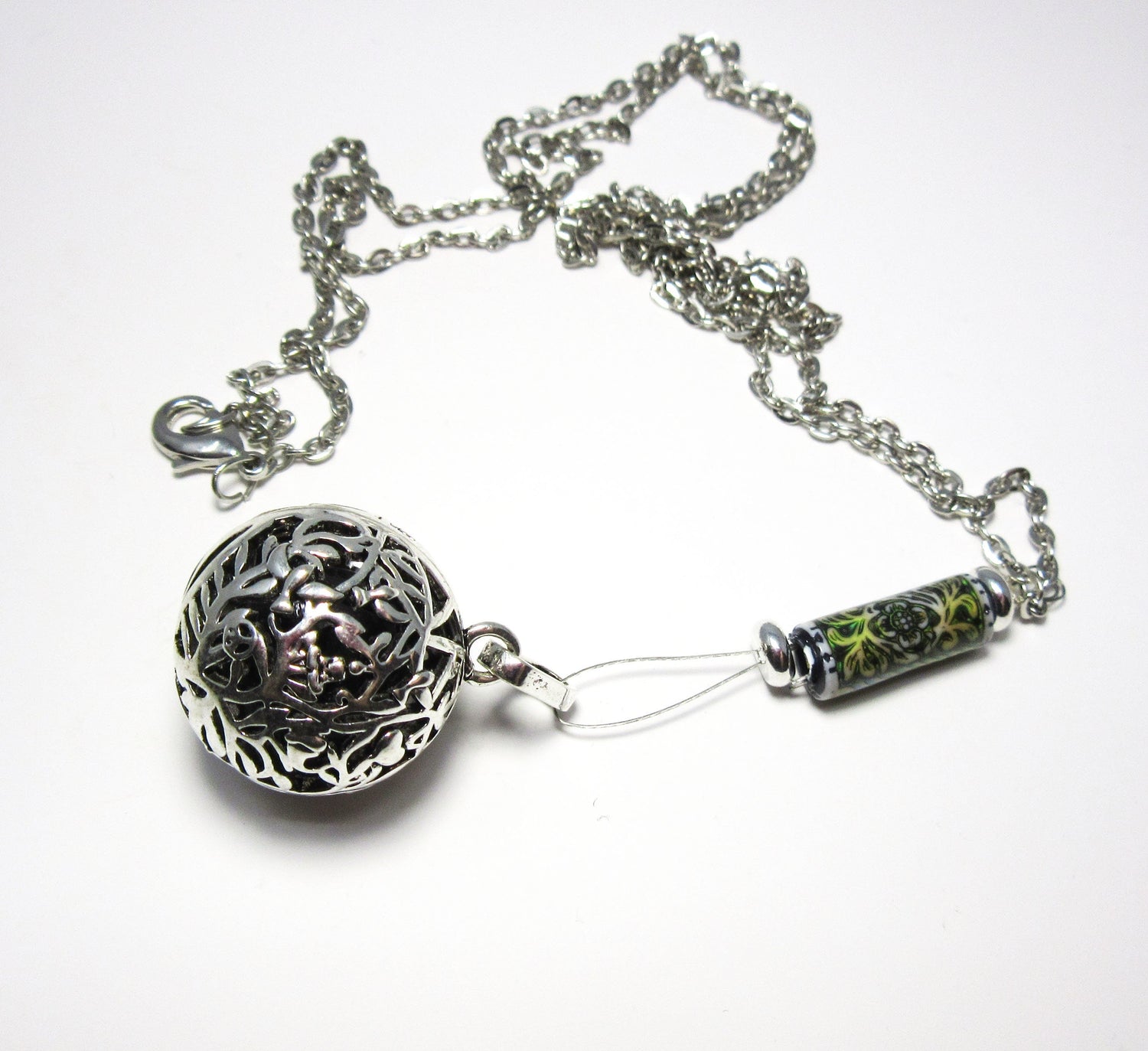 Close-up of Diffuser Necklace showcasing floral pendant and colorful lava beads, highlighting its essential oil diffuser capabilities and elegant design.